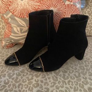 Suede and patent leather ankle boots. 2.75” heel with gold chain around toe